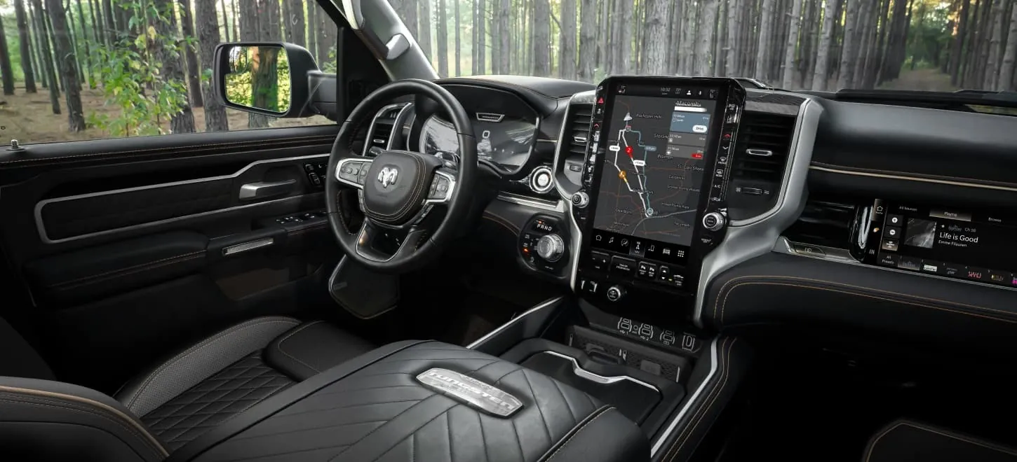 Ram 1500 interior dashboard with the large vertical touchscreen and front seats