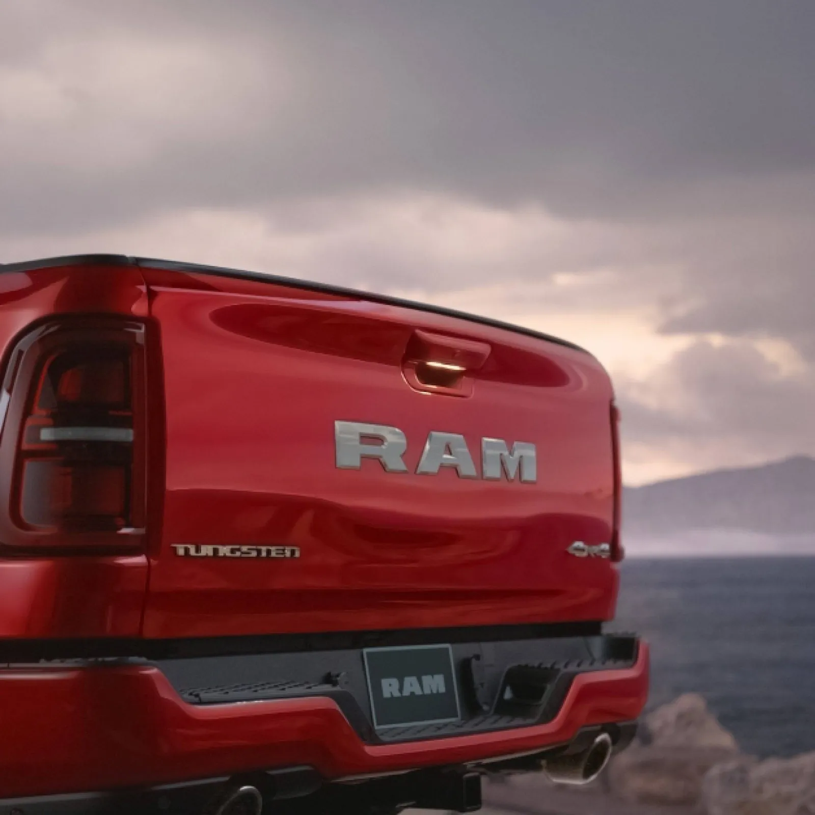 Close detail of a Ram 1500 tailgate showing the stamped RAM lettering