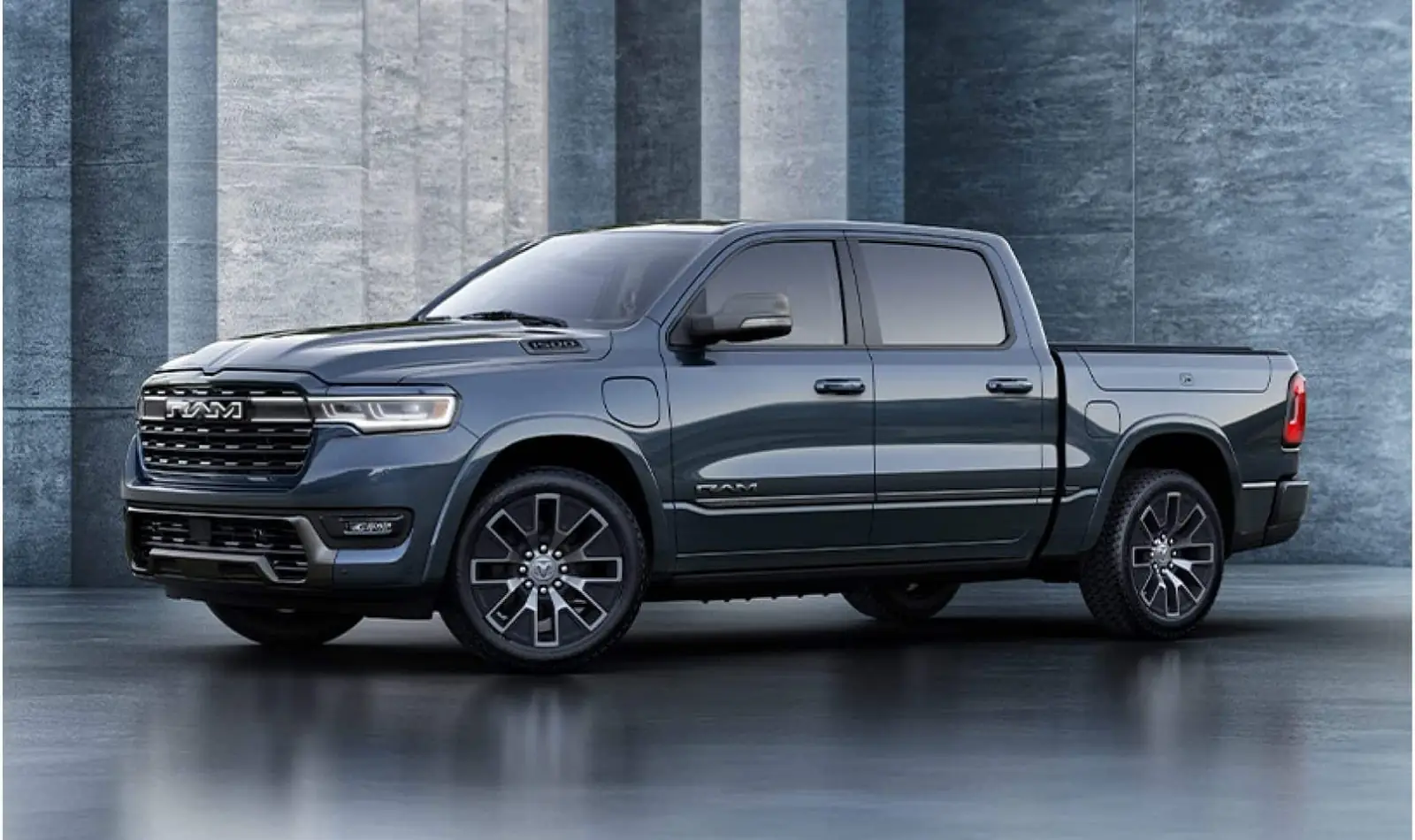 grey Ram 1500 REV side profile showing the illuminated grille and front fender charge port