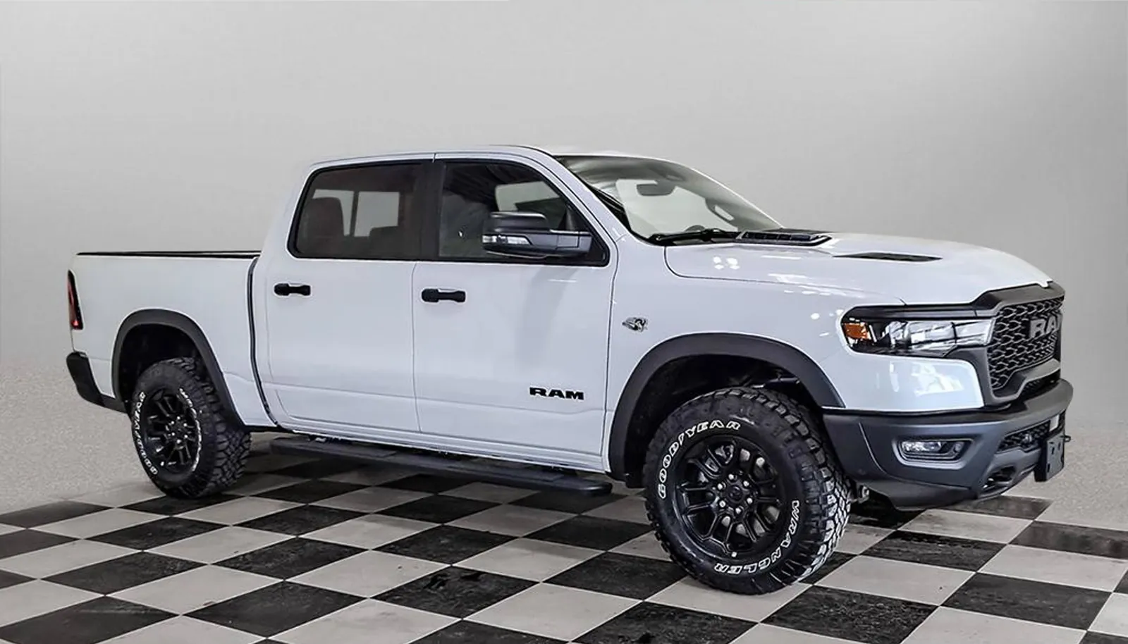 Bright white 2026 Ram 1500 Rebel Crew Cab shown front three quarter