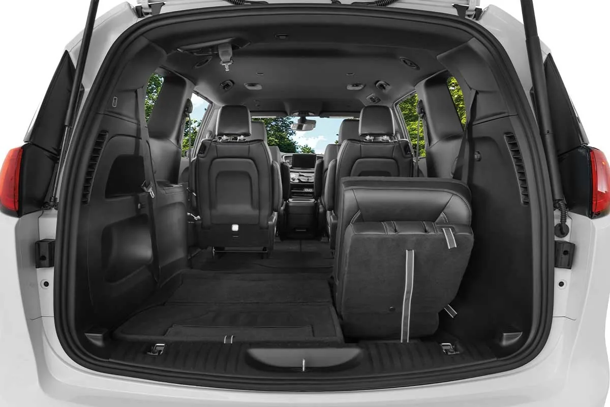 Chrysler Grand Caravan rear cargo area with the third row folded flat into the floor