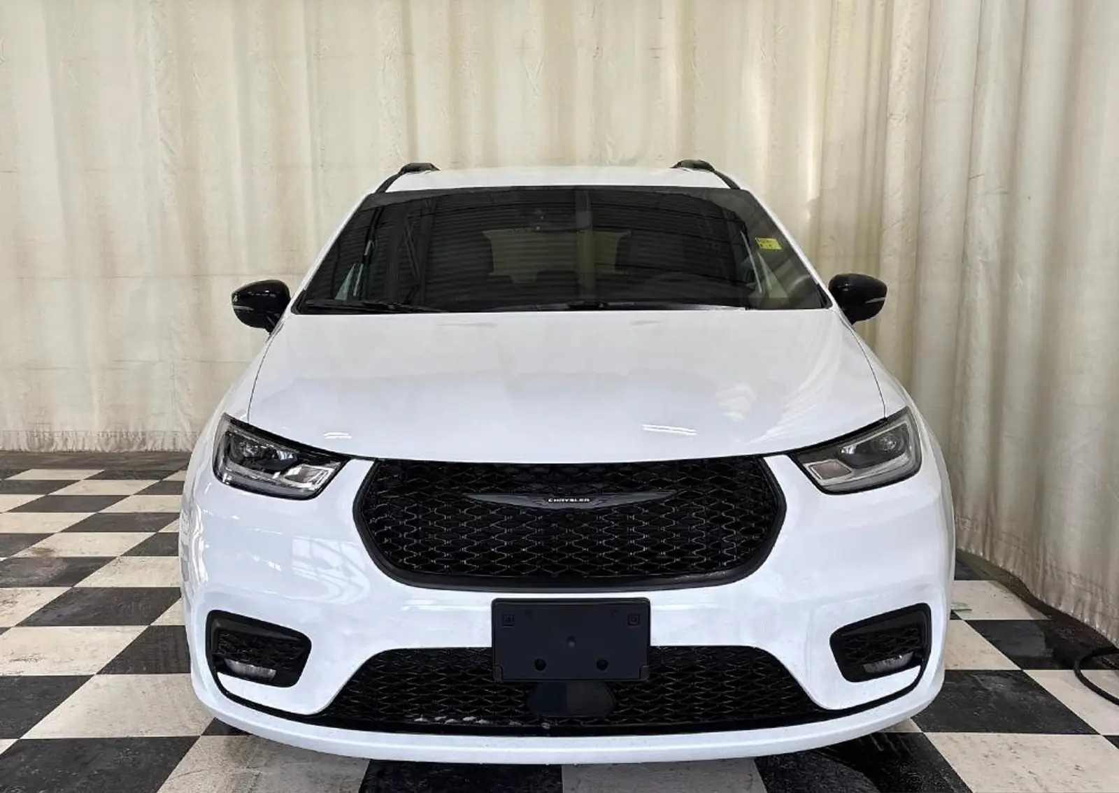 Bright White 2026 Chrysler Pacifica Select photographed on the dealership lot