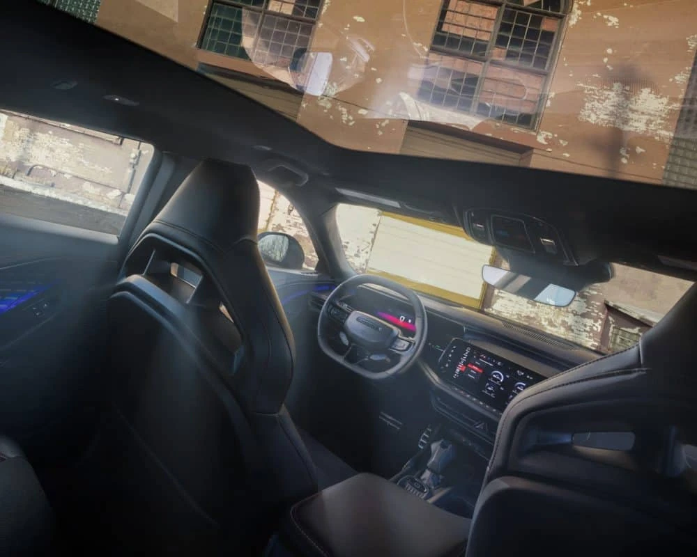 2026 Dodge Charger interior with steering wheel and dual screens