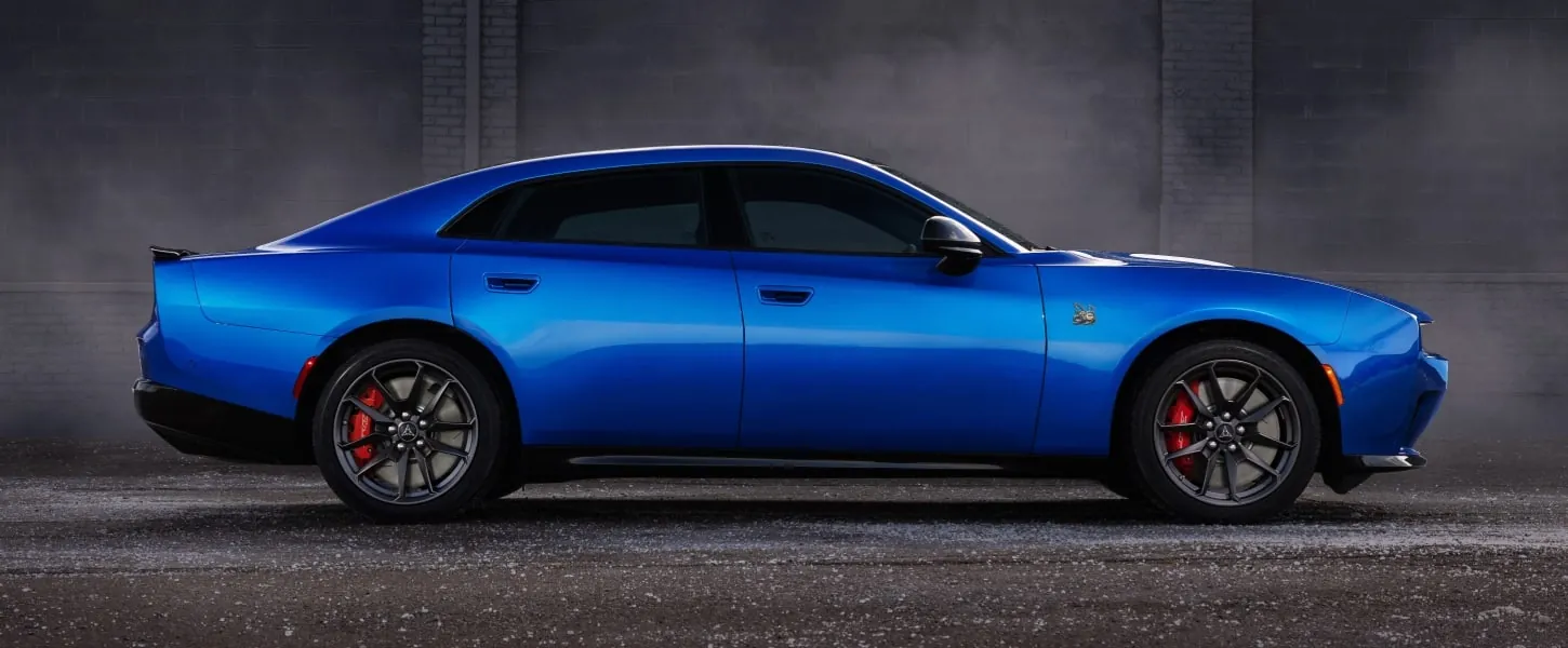 Blue Dodge Charger four door side profile with red brake calipers