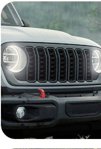 2026 Jeep Gladiator seven slot grille and round LED headlamps seen straight on