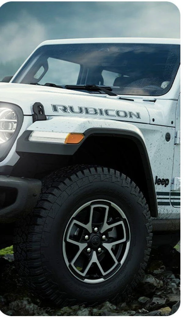 2026 Jeep Gladiator front fender, wheel and all terrain tire on wet rock