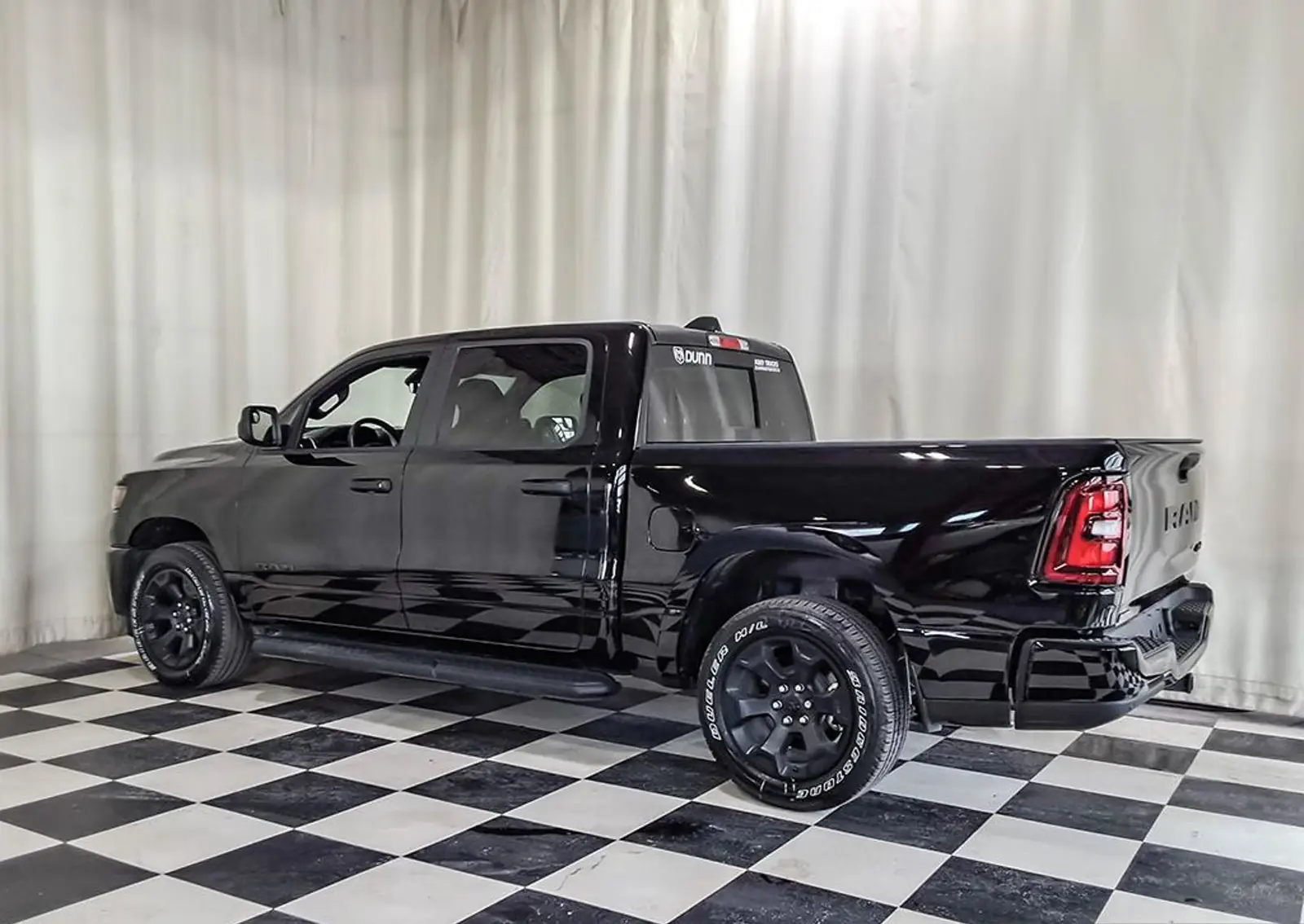 Black Ram 1500 Express Crew Cab rear three quarter studio exterior photo