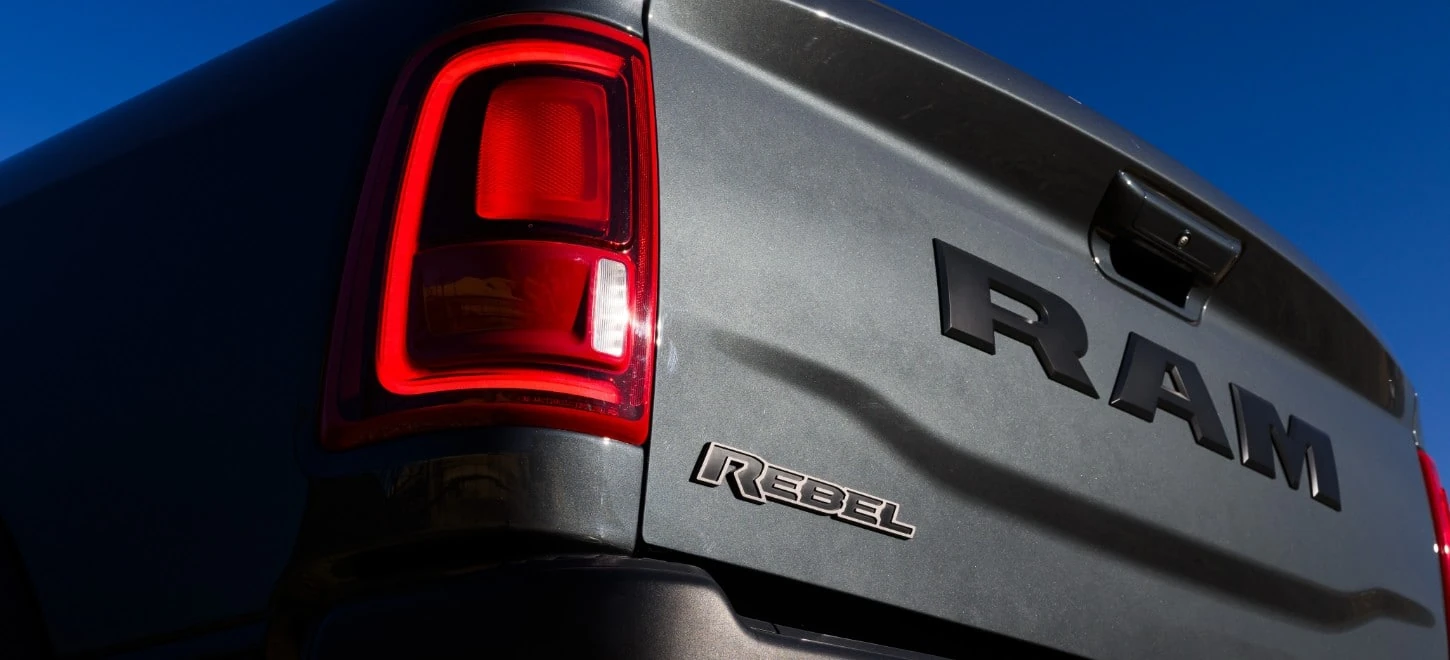 Ram 2500 Rebel tailgate detail showing the RAM lettering and REBEL badge
