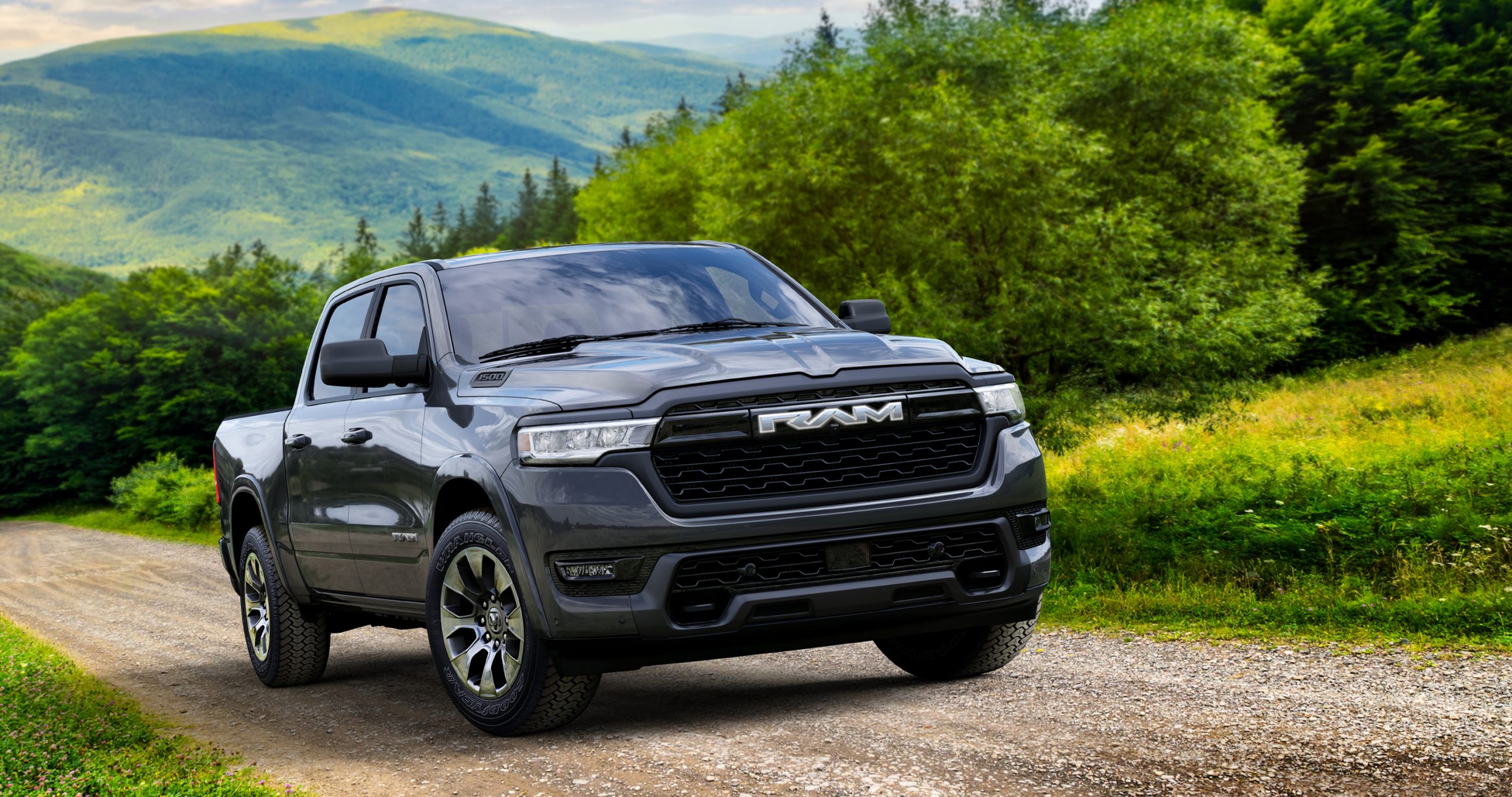 granite grey Ram 1500 parked on a gravel back road in front three quarter view