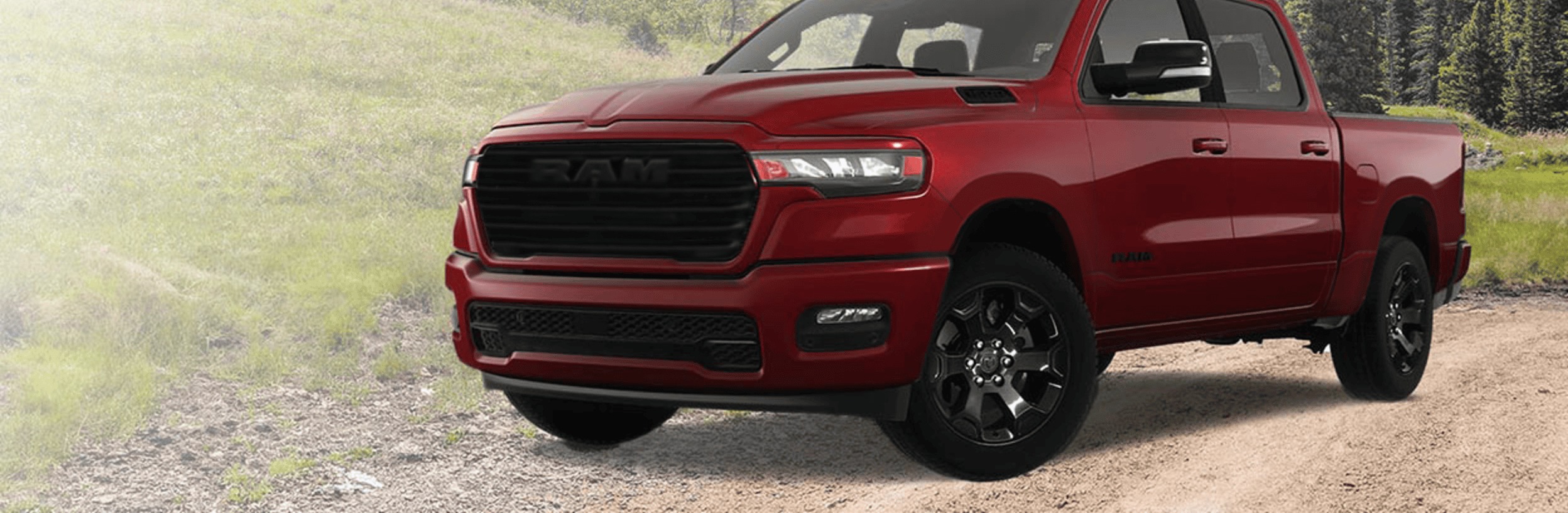 red Ram 1500 Sport front three quarter view on a gravel road