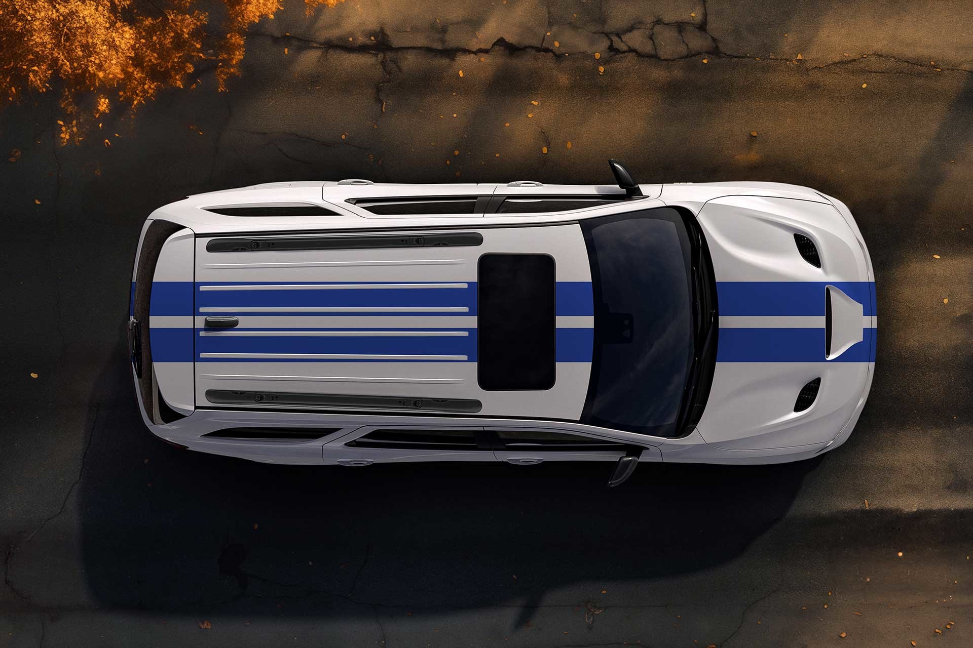 white Dodge Durango with roof rails, three quarter exterior view on a driveway