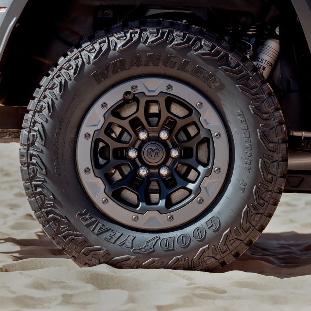 35 inch off road tire and wheel with the shock visible on a Ram 1500 TRX