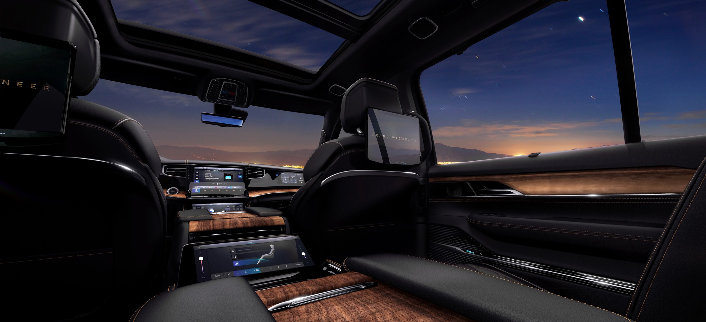 Jeep Grand Wagoneer interior with the dashboard screens and sunroof