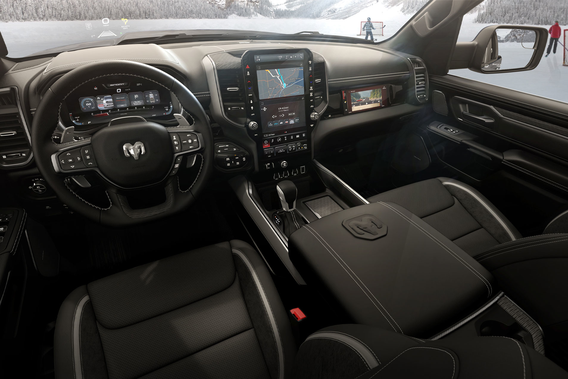 2026 Ram 1500 Sport dashboard and front cabin with a winter scene through the windshield