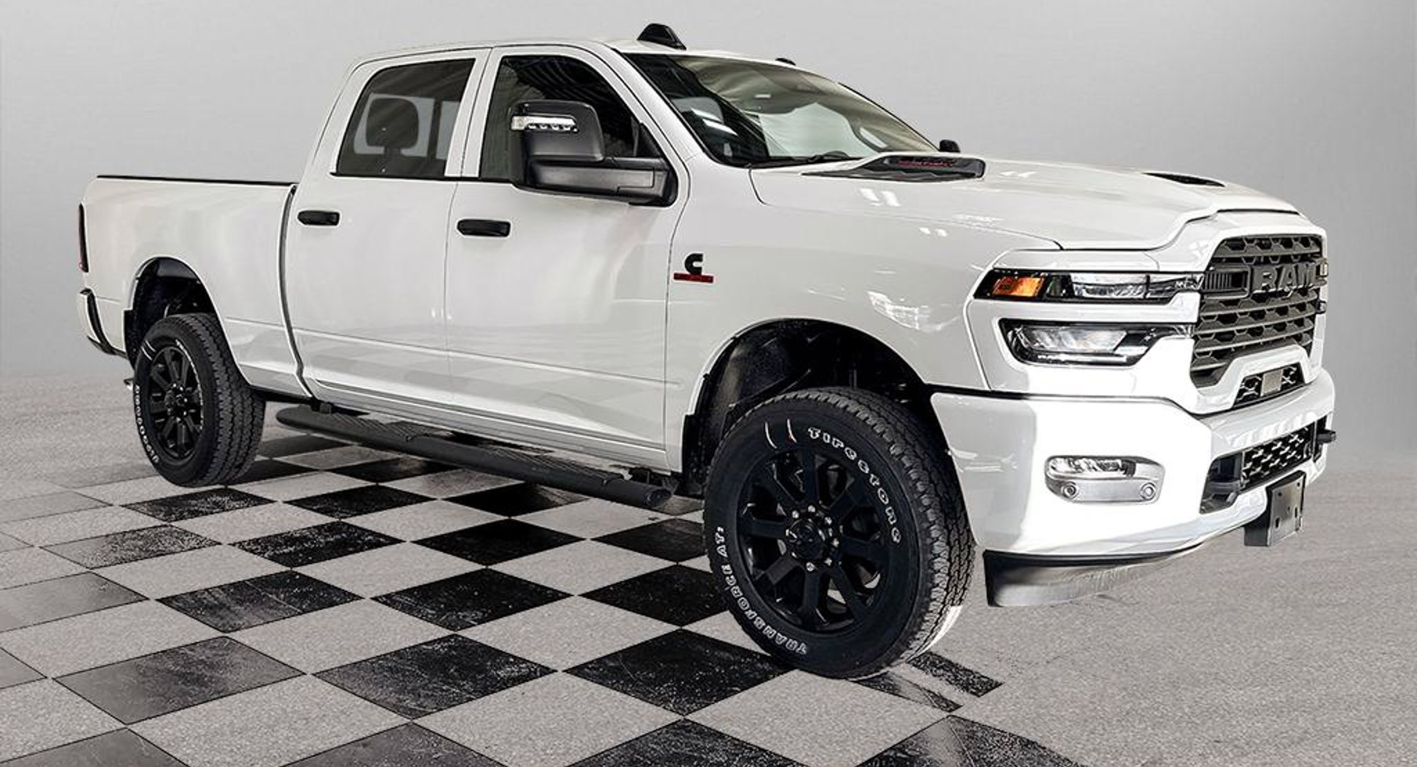2027 Ram 2500 Black Express in Bright White, studio photo of a Dunn Ram Trucks unit