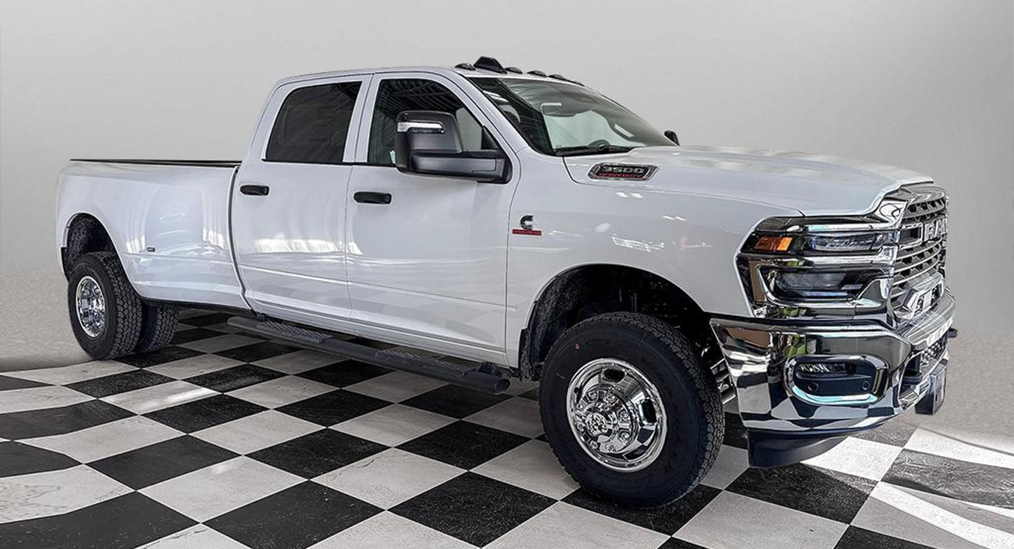 2027 Ram 3500 Tradesman dually in Bright White, studio photo of a Dunn Ram Trucks unit
