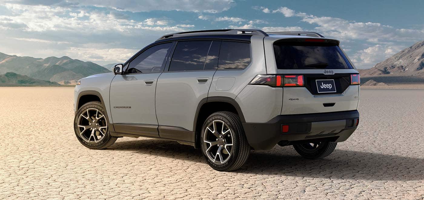 2026 Jeep Cherokee hybrid rear three quarter view showing the liftgate and rear bumper