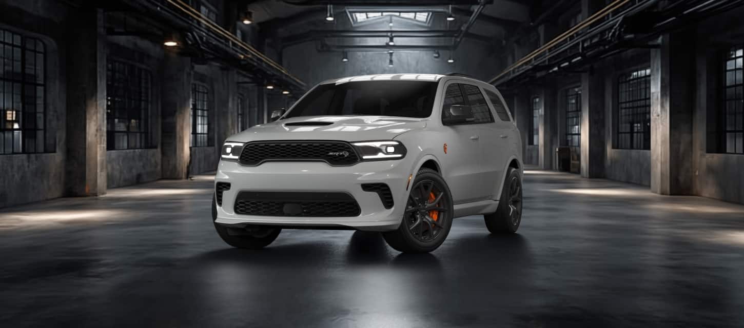white 2026 Dodge Durango SRT, front three quarter view in a warehouse