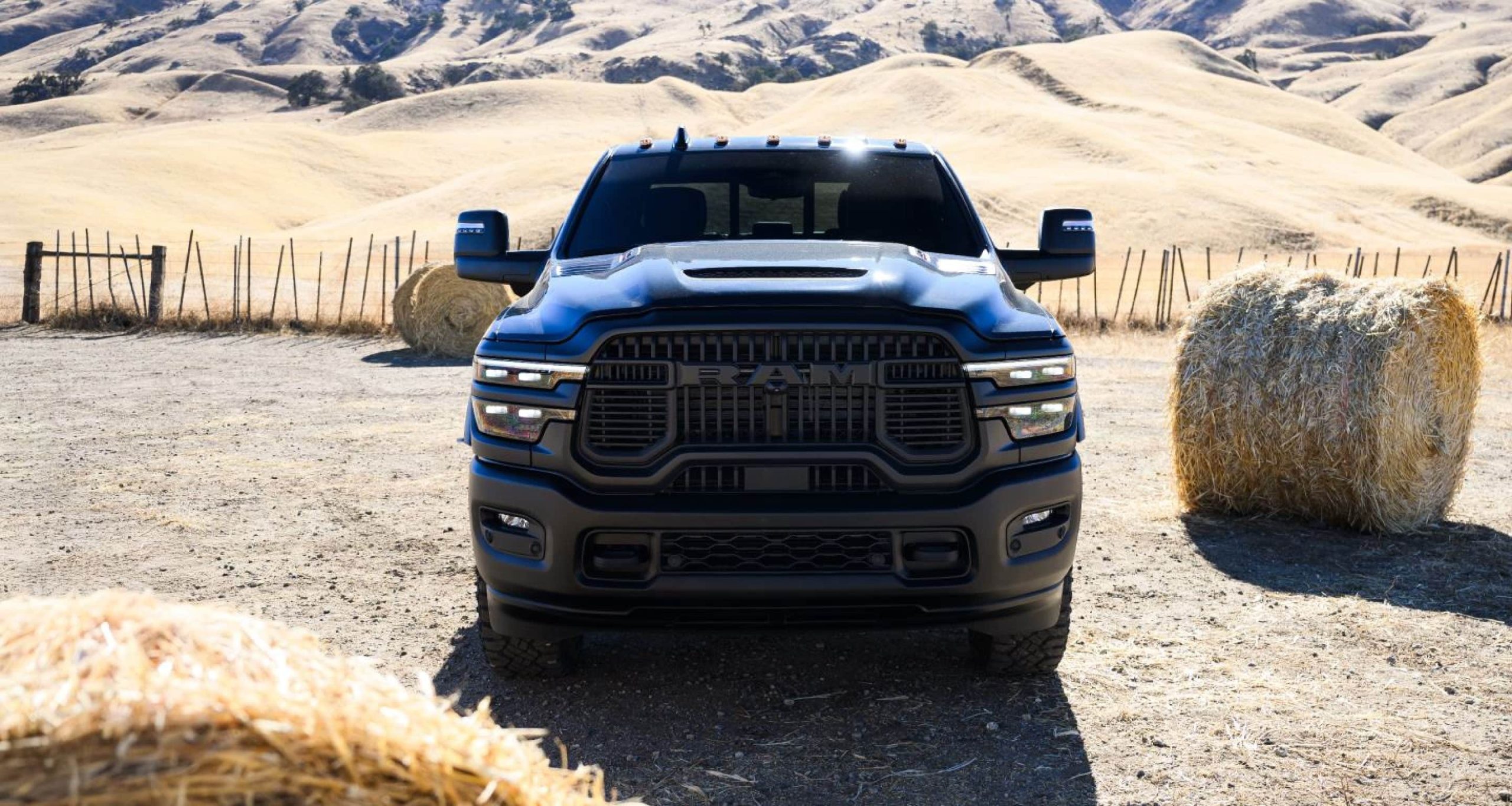 2027 Ram 2500 Rebel head on with the black grille and Rebel hood scoop, Ram's 2027 image