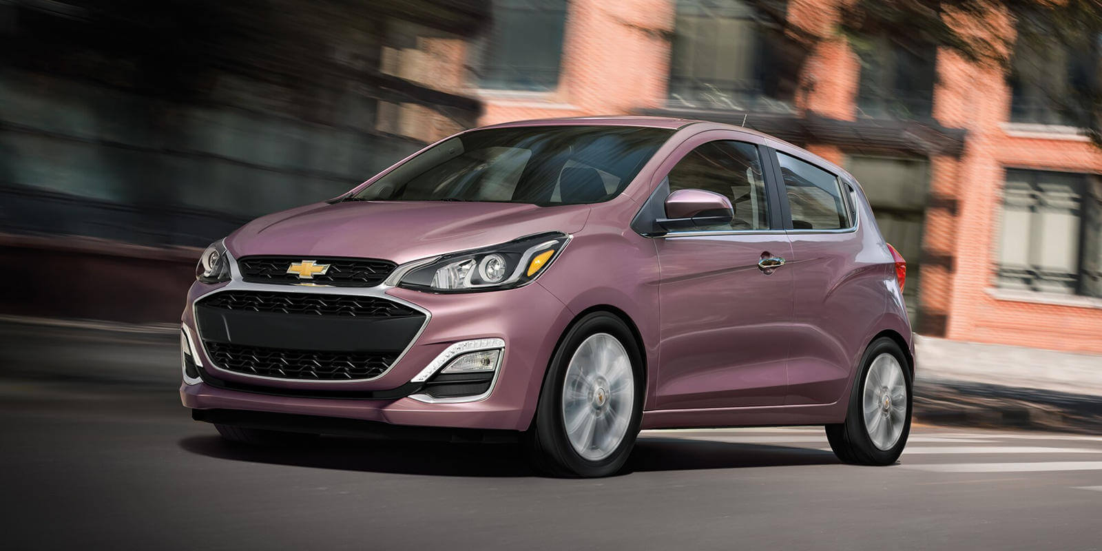 Pink 2022 Chevrolet Spark Driving