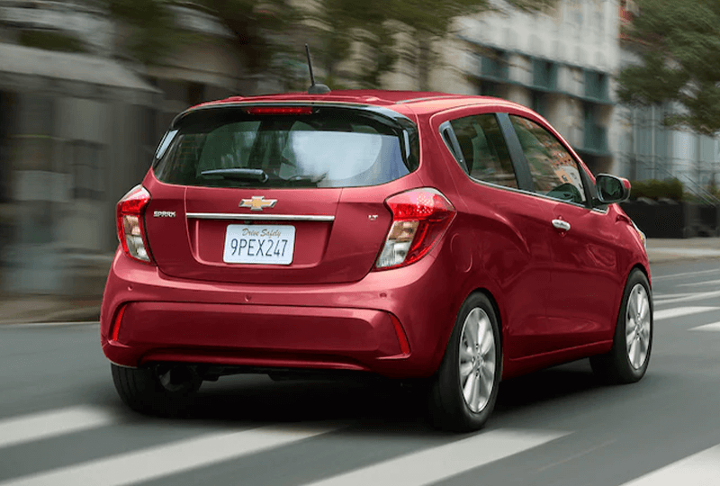 Red 2022 Chevrolet Spark Driving