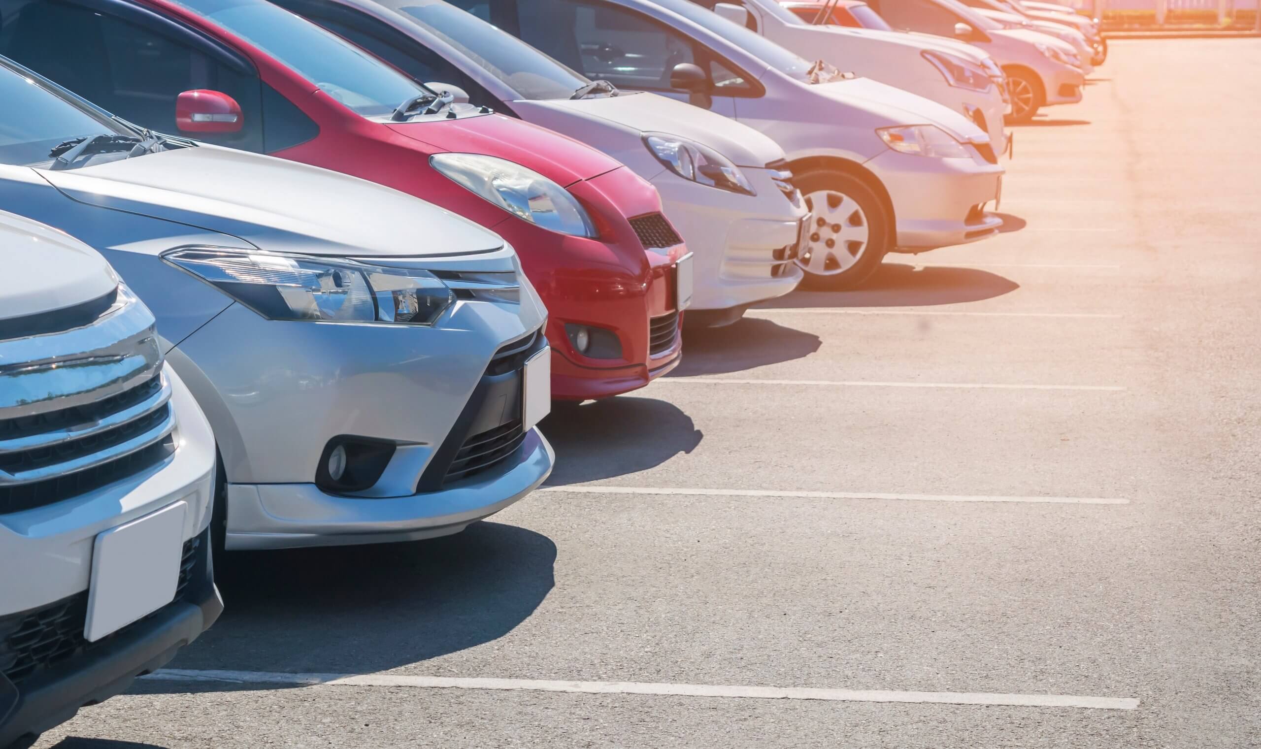 Vehicles lined up in a parking lot