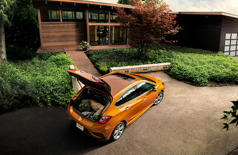 2018 Chevy Cruze hatchback in orange with trunk open