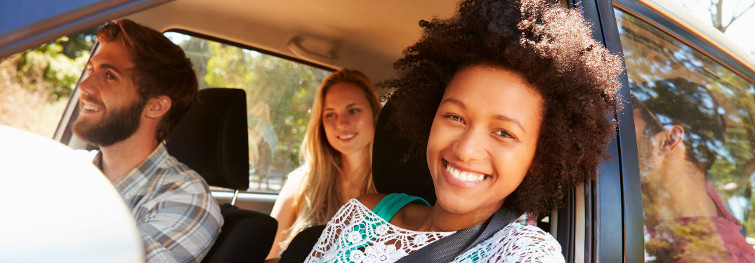 Young people inside a vehicle