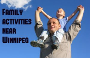 man holding son on shoulders caption "family activities near winnipeg"