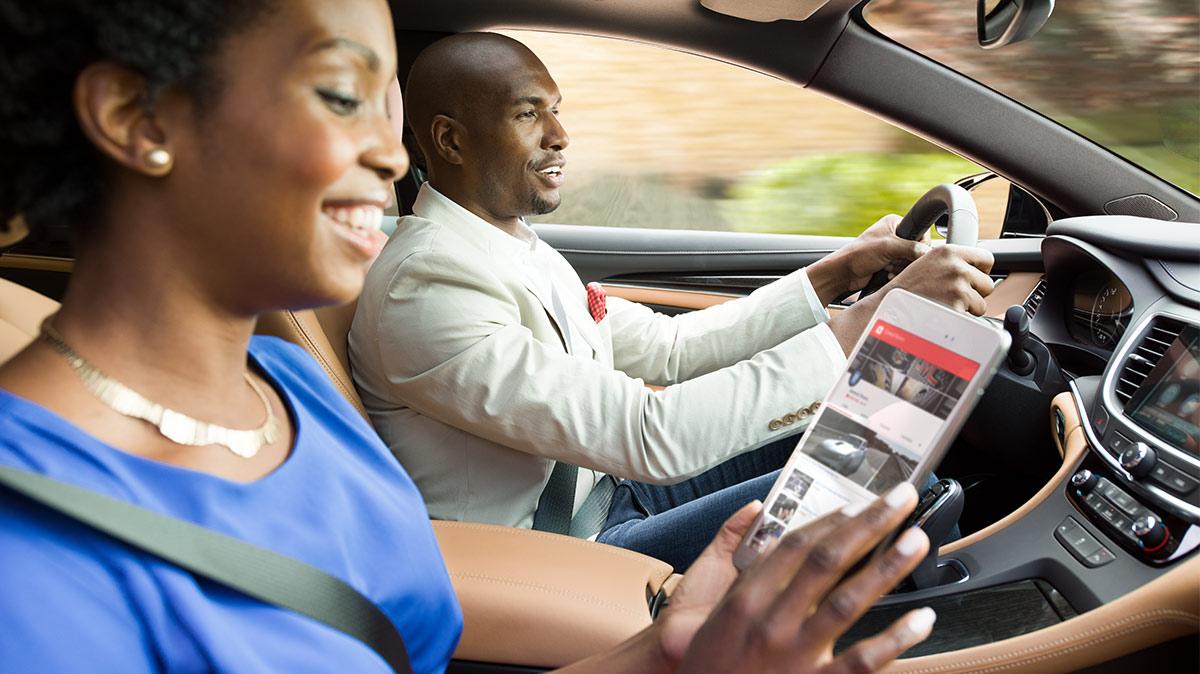 Couple sitting in a GM vehicle