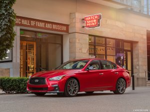 red vehicle in front of a store