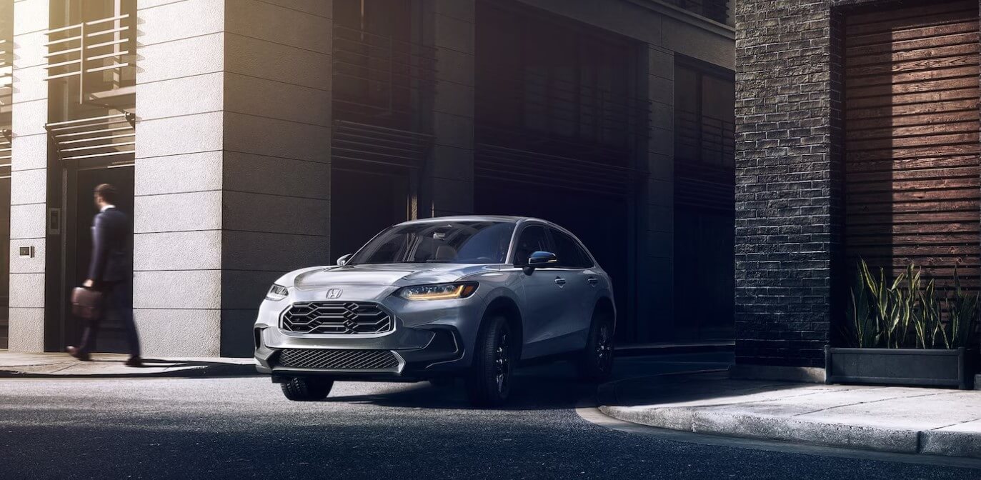The new 2025 Honda HR-V turning the corner on a city street, making this Honda SUV perfect for the city roads. Shop for your new 2025 Honda HR-V at Midlands Honda in Columbia today.