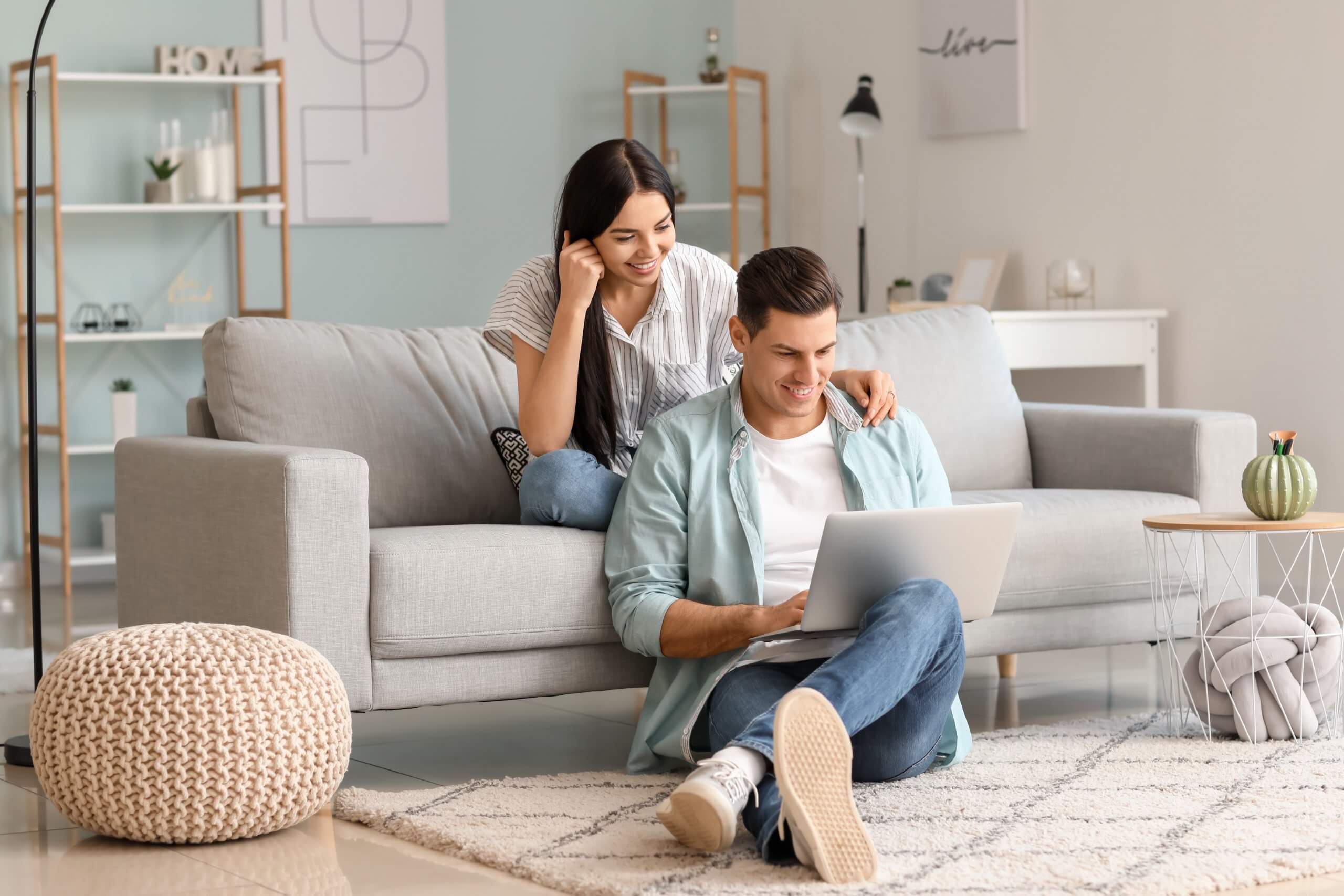 Couple looking at a laptop for a car financing