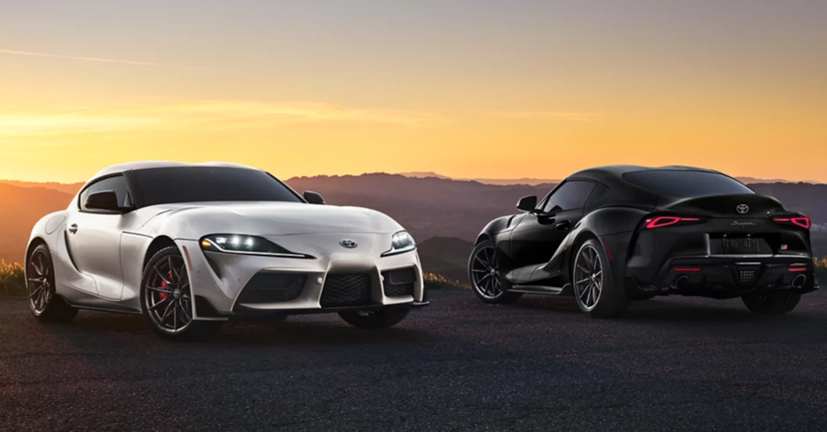 Two Toyota Supra sports cars parked side-by-side