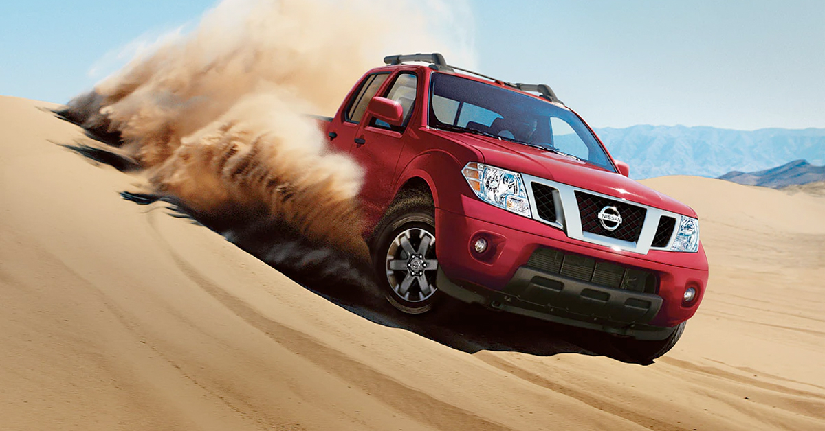 Nissan Frontier driving across sand