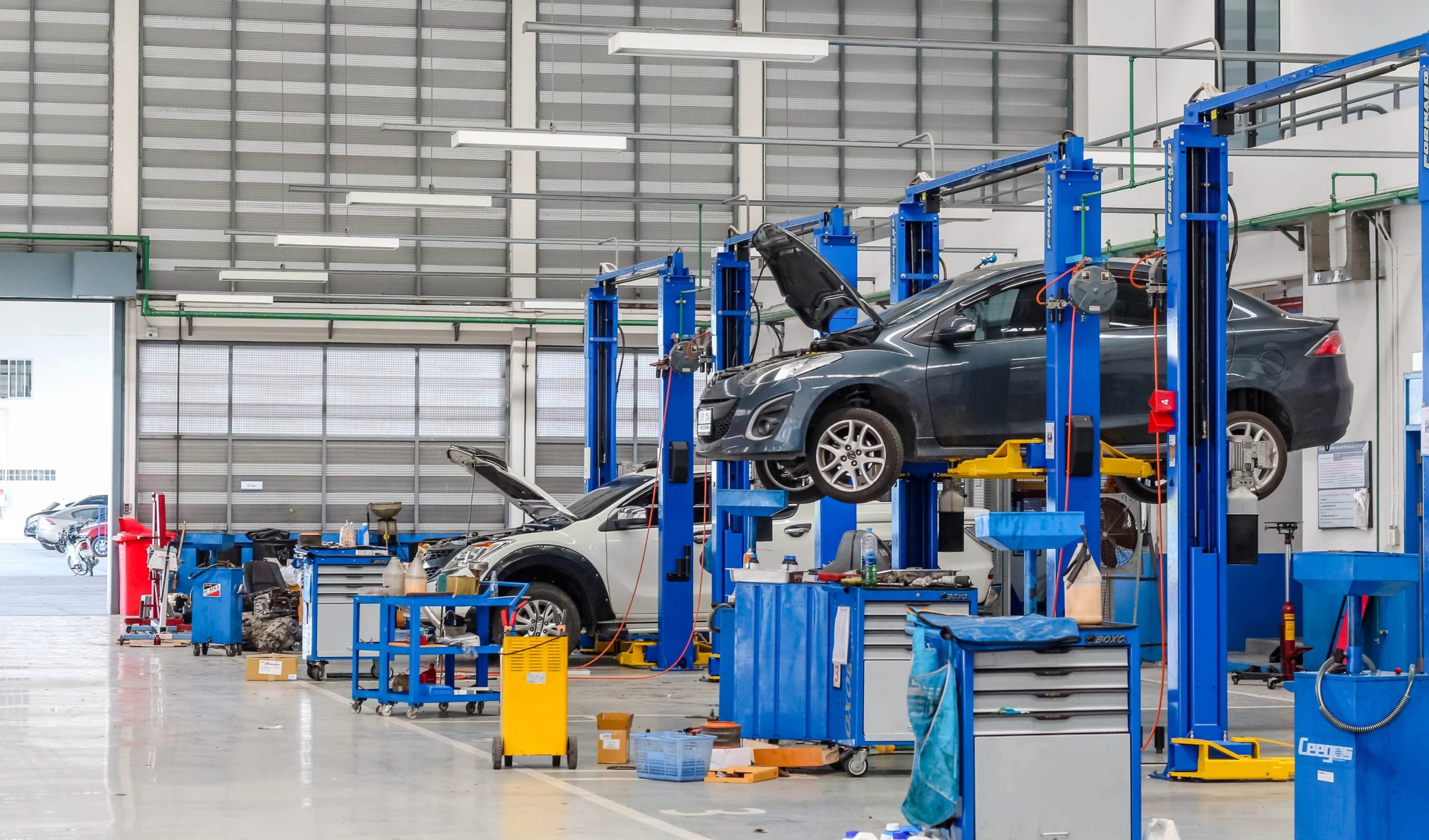 Car on lifts at a mechanic's shop