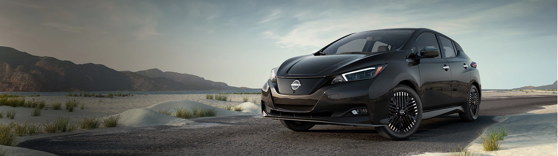 Black Nissan Sedan on the beach