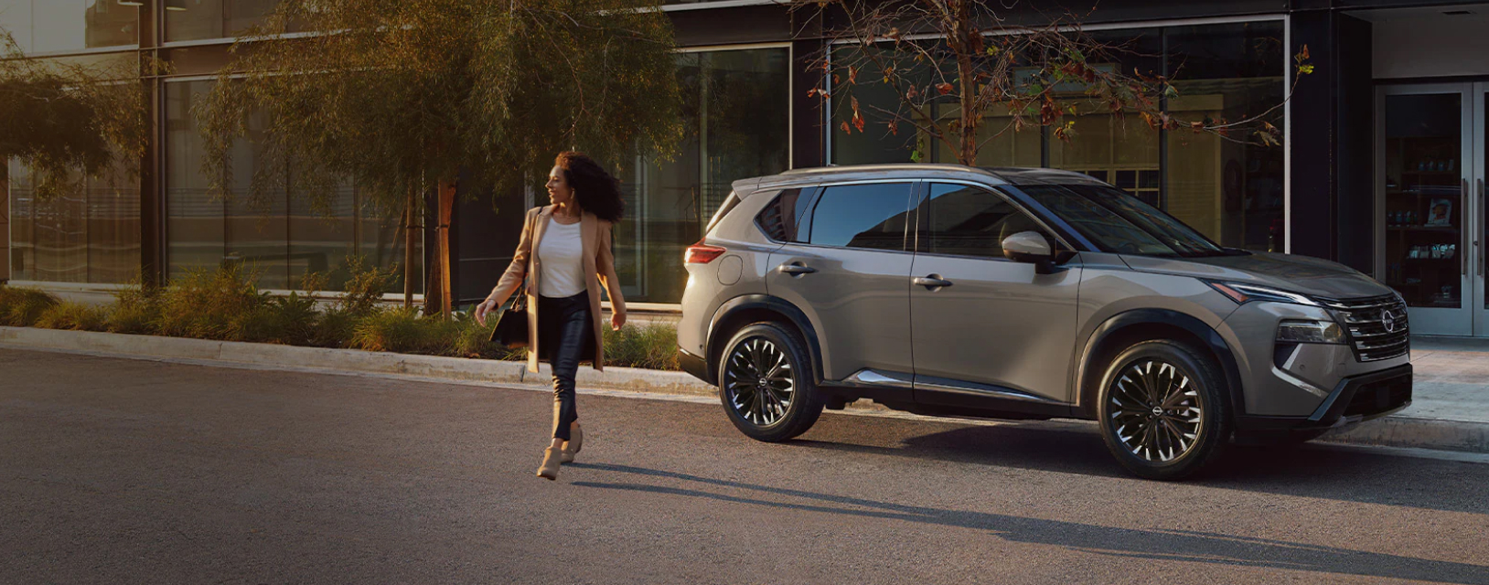 Woman walking away from her parked Nissan SUV