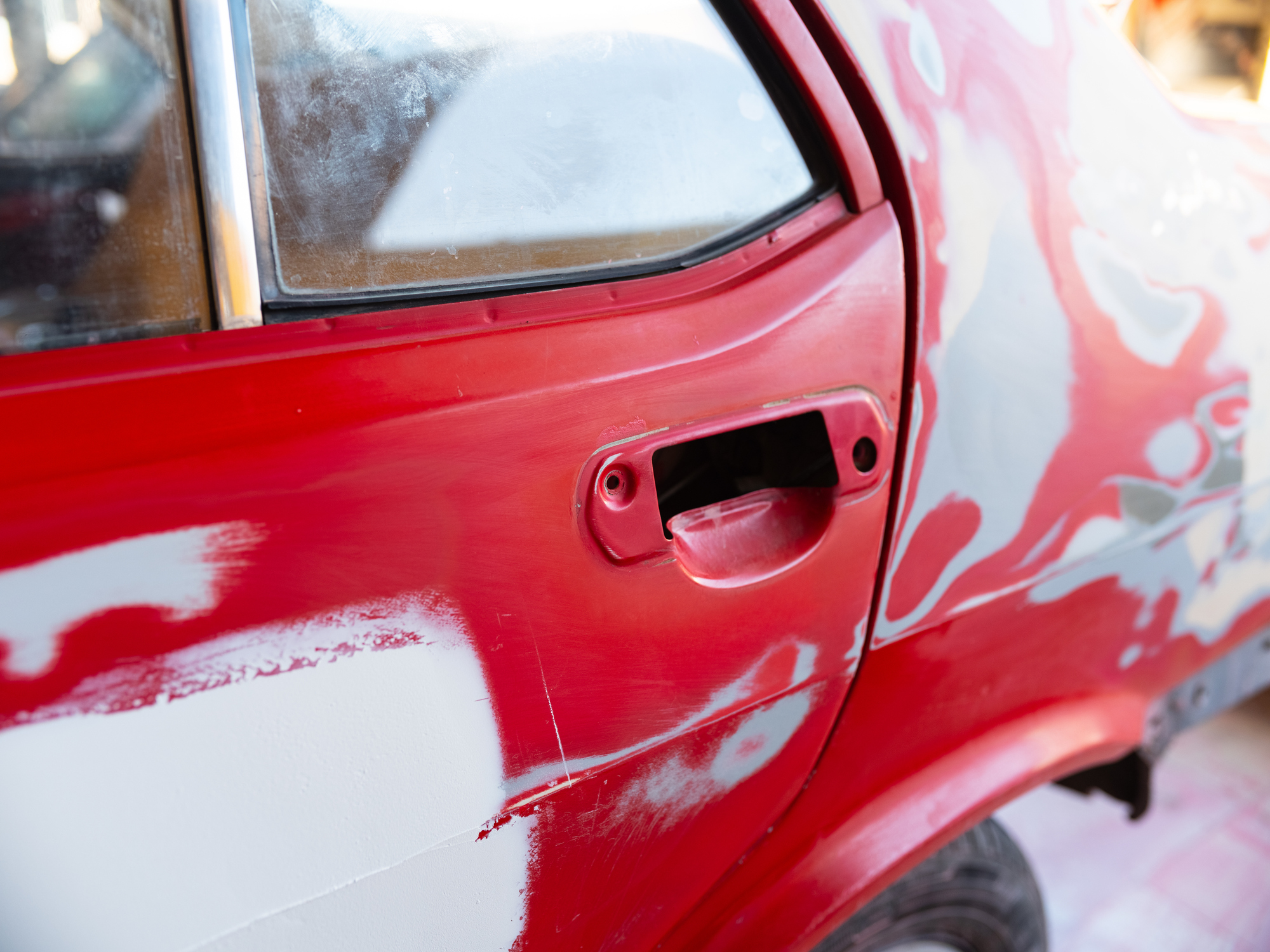 Fixing red dents on a red vehicle