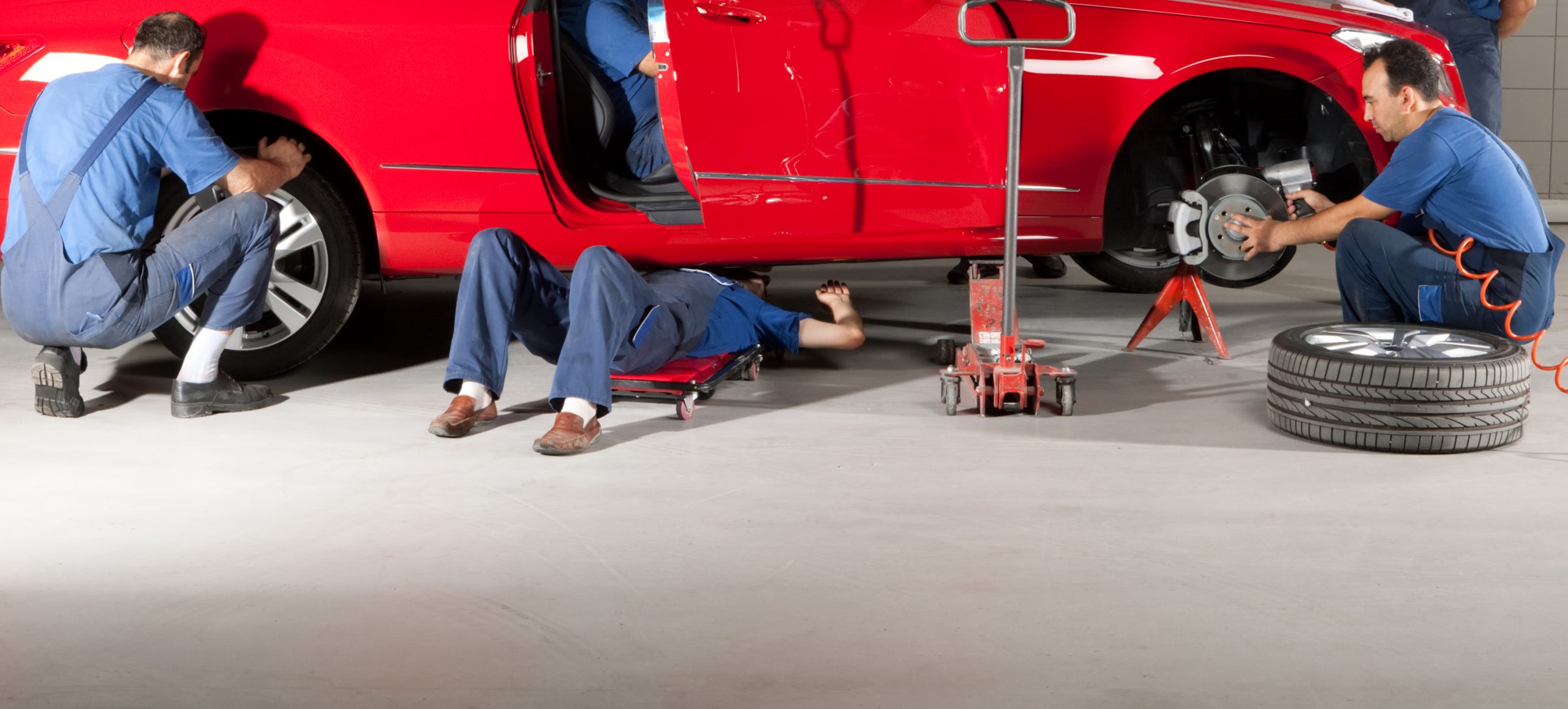 Bush Service Technicians working on a red vehicle