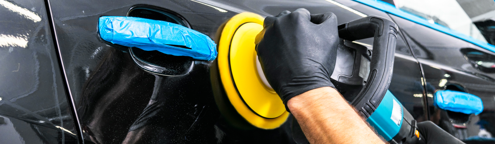 Technician Buffering Black Vehicle Door