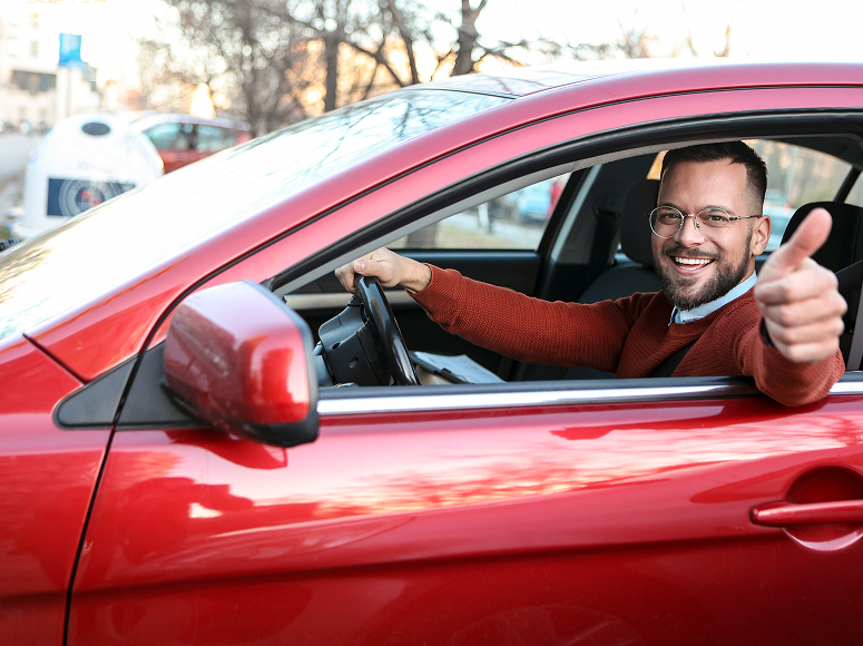 Happy Customer in a red sedan
