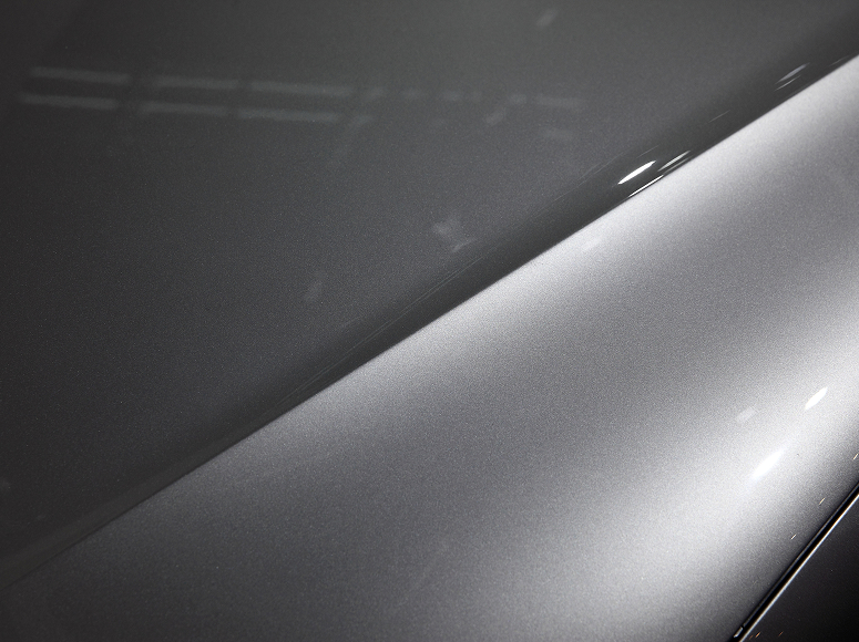 Close up of a gray vehicles hood