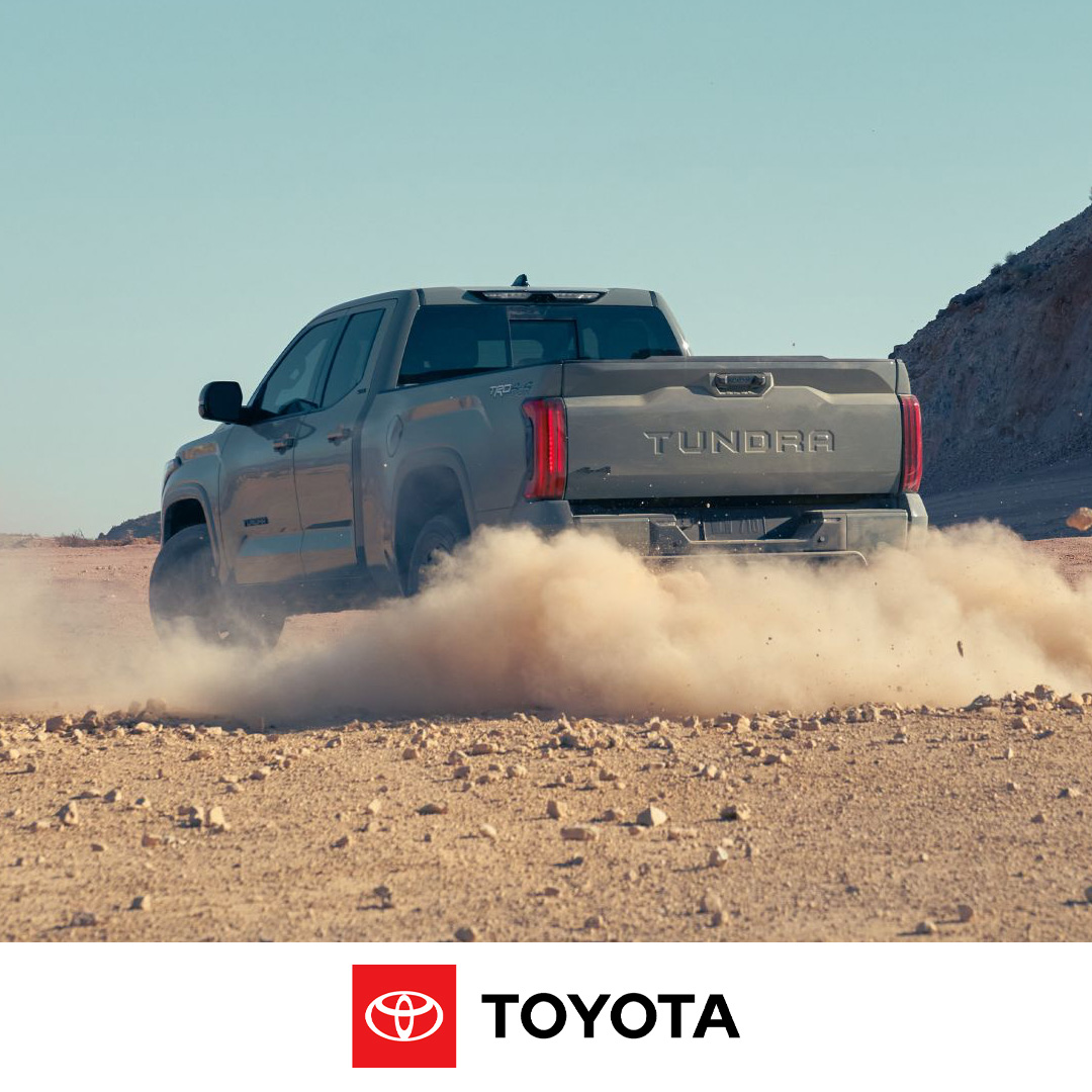 2024 Toyota Tundra truck cruising on a dusty dirt road