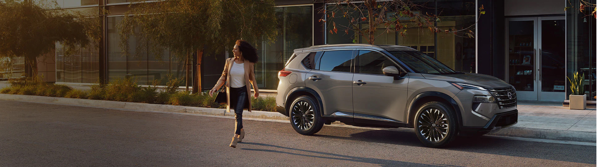 Lady walking away from parked Nissan SUV