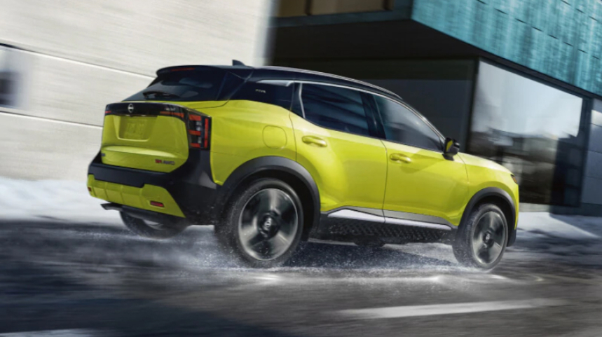 Yellow Nissan SUV driving on the street