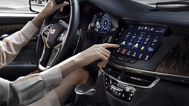 Front dashboard of a Cadillac vehicle.