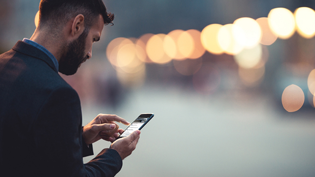 Man on his smart phone.