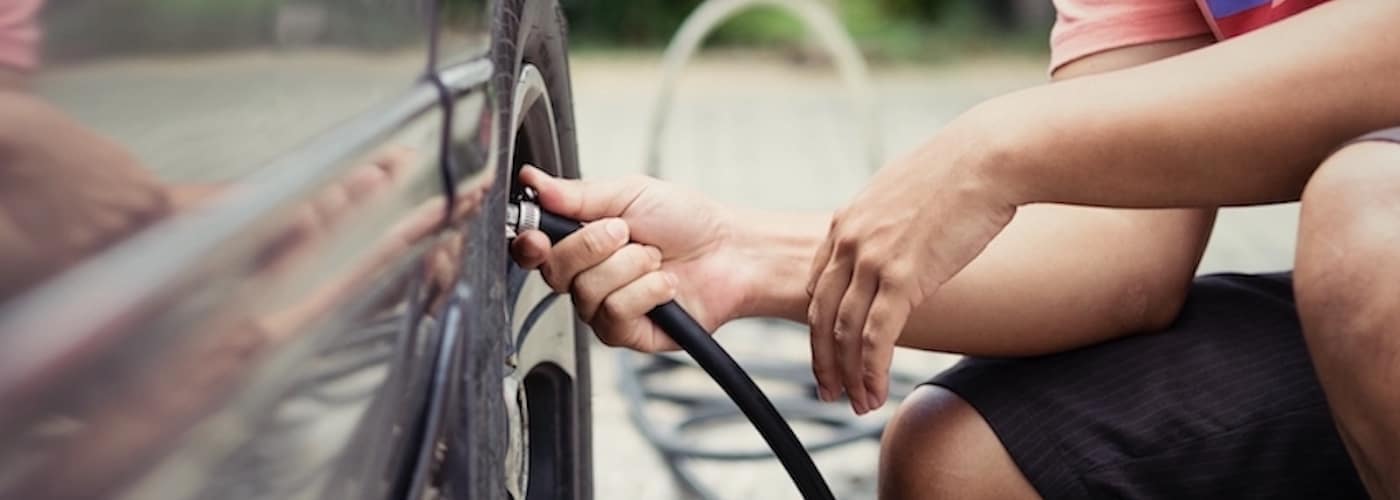 Man filling up tire