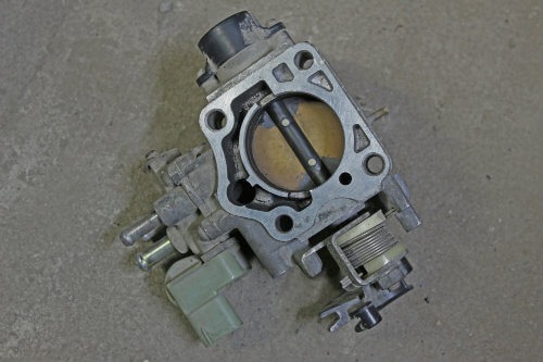 A damaged throttle body from a car may cause a loss of engine power